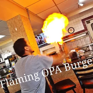 a man throwing a burger into the air