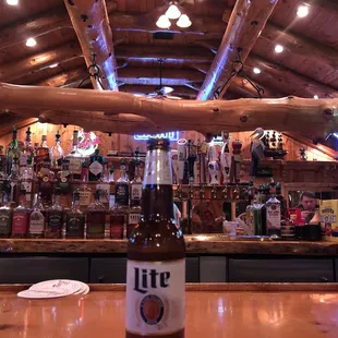 a beer bottle on a bar counter