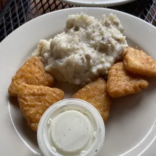a plate of food with mashed potatoes and gravy