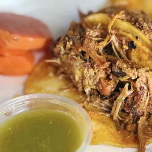 Cochinita tacos, mildly spicy carrots, &amp; green sauce.