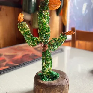 a cactus plant made out of beads