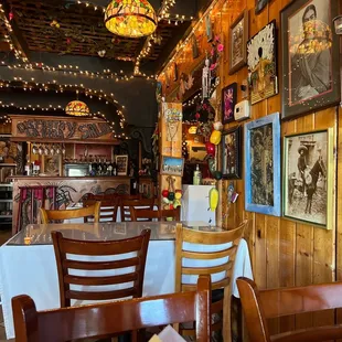 a dining area with tables and chairs