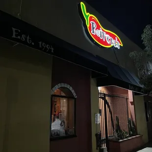 a neon sign for a mexican restaurant
