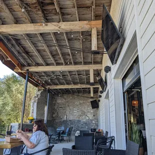 a woman sitting on a patio