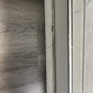 broken quarter round held together by putty