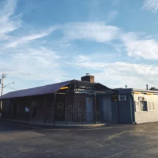 a building with a red tin roof