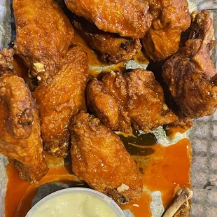 Naked wings with hot sauce and blue cheese.