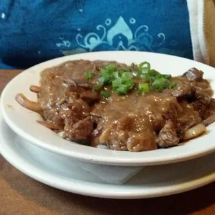 Beef tips over rice