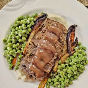 Venison Meatloaf- Mashed Sunchokes,horseradish peas, maple glazed carrots, Rosemary port Reduction