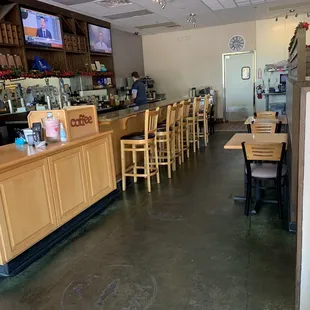 Front entrance of restaurant.  There is a bench to the right of picture you can barley see.