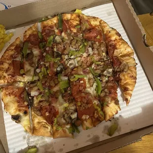 Pizza cut incorrectly missing the crust topping that was paid extra for