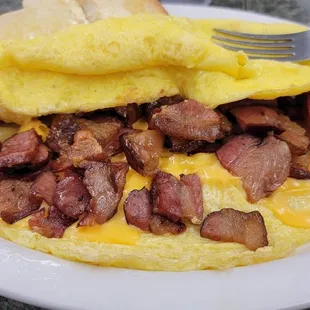 Look at all that thick cut bacon in the omelette
