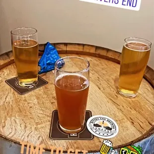 Two of the pilsners and a hazy ipa (center)