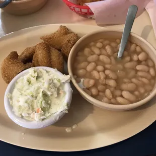a bowl of beans and a bowl of coleslaw