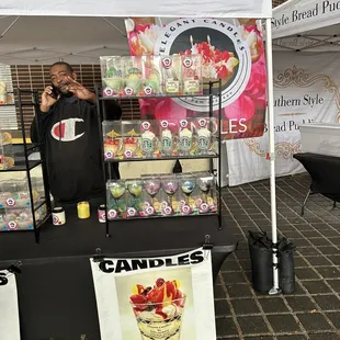 a man standing in front of a display of candies
