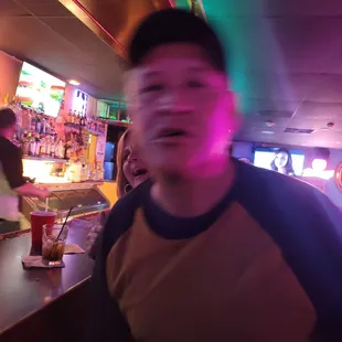 a man sitting at a bar