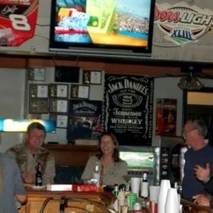 a group of people sitting at a bar
