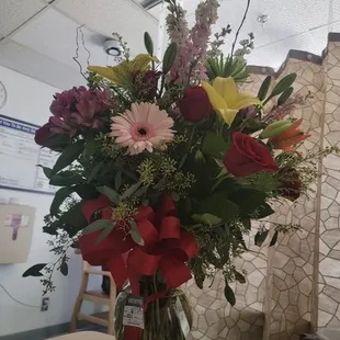 This is $170 arrangement. How disappointing 6 roses, 1 gerber daisy, and a few lilies. I can't even believe it.