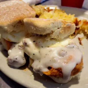 The Charlie:  fried chicken tenders with eggs and gravy on s biscuit with hash browns