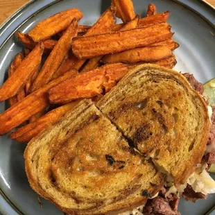 a grilled sandwich and sweet potato fries