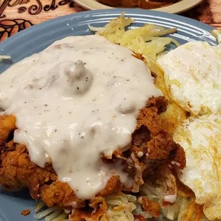 Chicken fried steak hash browns, toast, eggs.