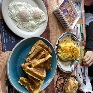 a breakfast of eggs, toast and biscuits