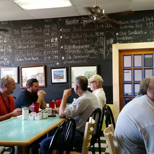 a group of people sitting at a table