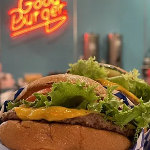 a hamburger with lettuce and cheese