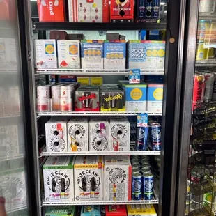 a display of beer in a cooler