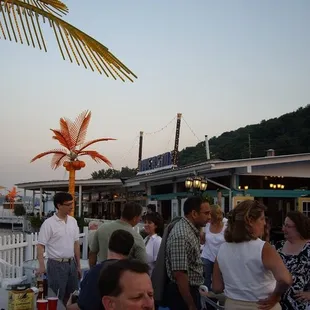 a group of people standing on a dock