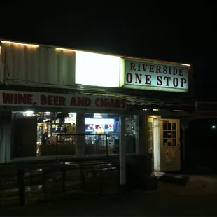 the front of the restaurant at night