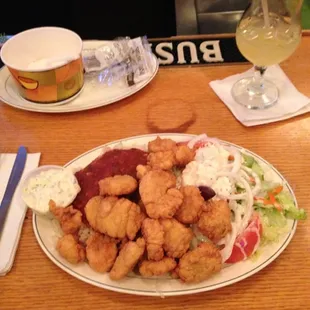 Fried scallops, rice with sauce &amp; a Greek salad.