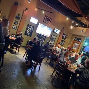 a large group of people sitting at tables