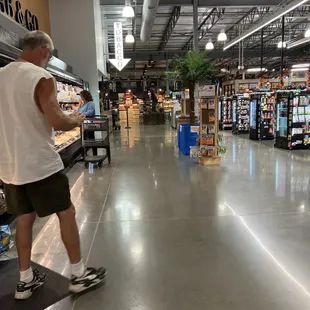 a man on a skateboard in a grocery store