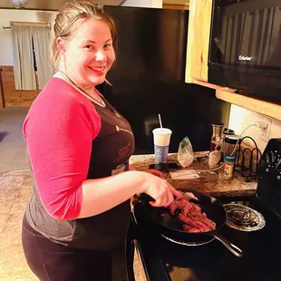 My wife cooking away first meal in cabin!