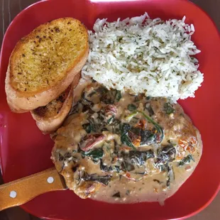 Tuscan chicken with jasmine rice and garlic bread.  Absolutely delicious!