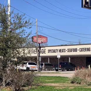 Across the street from Walgreens and backing up to the Plaquemine Ferry entrance