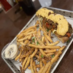 a tray of fries and a burger