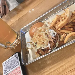 a burger and fries with a beer