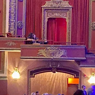 a crowd of people sitting on the stage