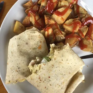 Chicken wrap with home fries.