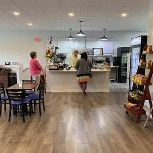 two people standing at the counter