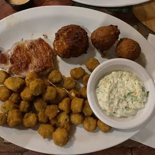 Pork loin, fried okra, crab cake, hush puppies, slaw