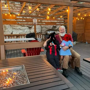 Clubhouse deck with cozy firepits and propane grills. Perfect for gatherings and relaxing evenings.