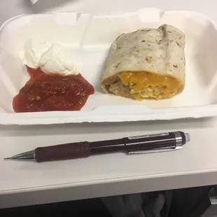 The sad half of a breakfast burrito. Not at all worth $8.25.
