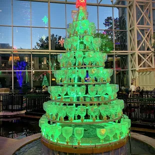 a christmas tree made out of wine glasses