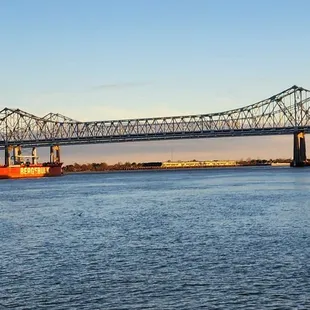 A Barge going under a Mississippi River Bridge