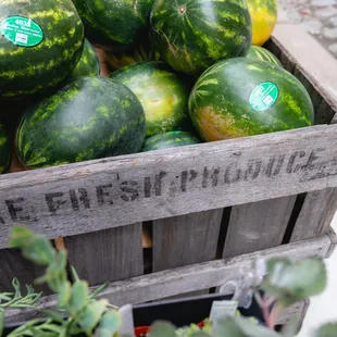 a crate of watermelons