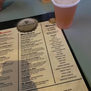the menu and drinks on the table