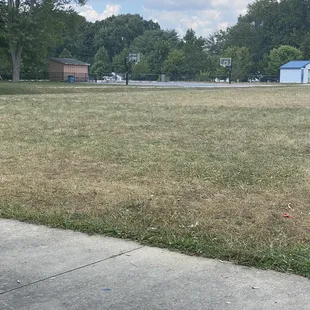 Basketball court and restroom(white building to the right)